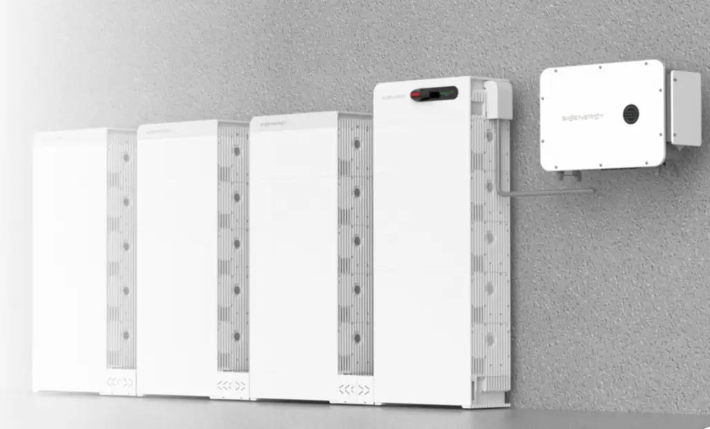 Multiple white stackable Sigen battery modules lined up cleanly side-by-side, displaying how the energy storage system physically scales outwards vertically.
